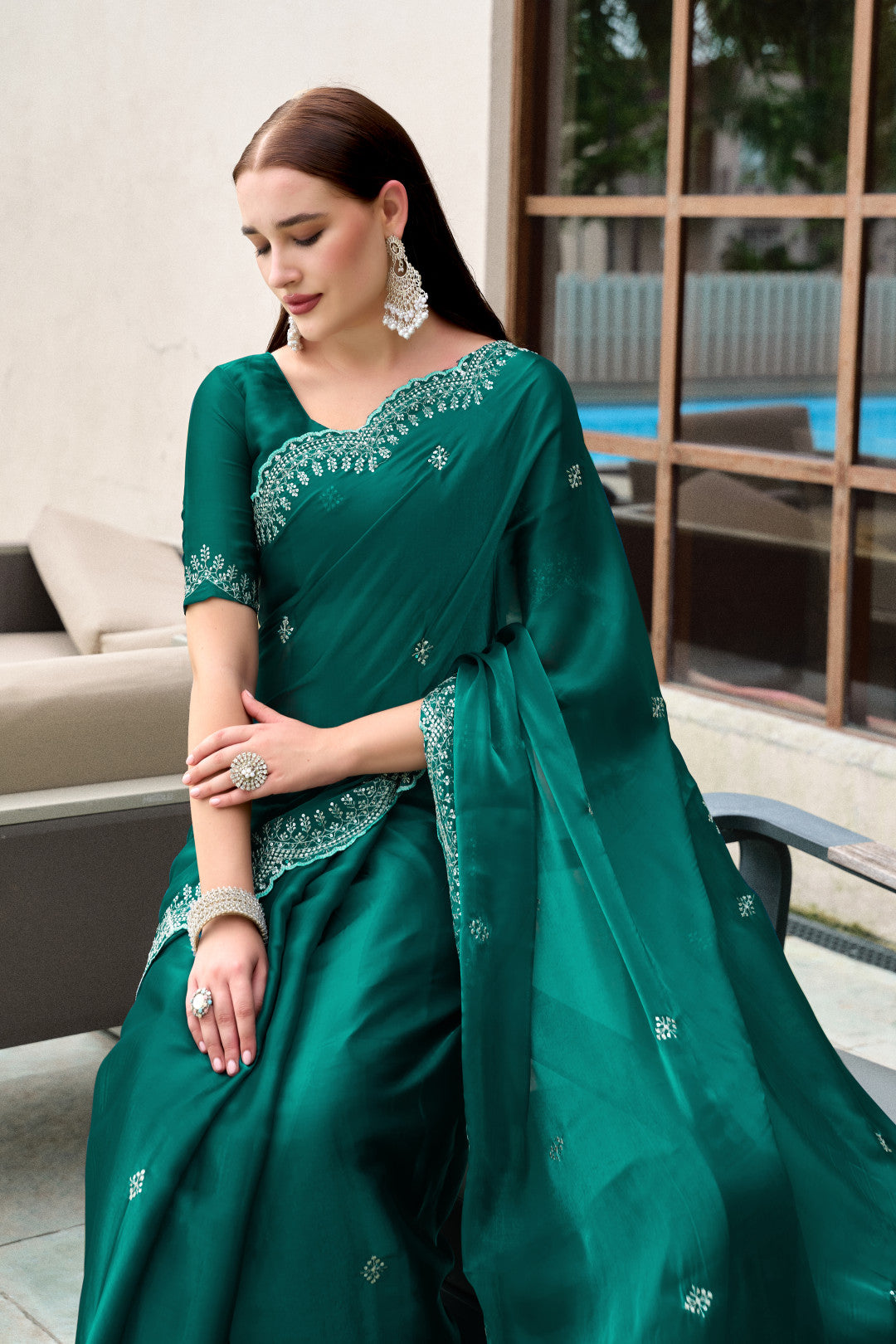 Dark green fancy shimmer chiffon saree with embroidery work