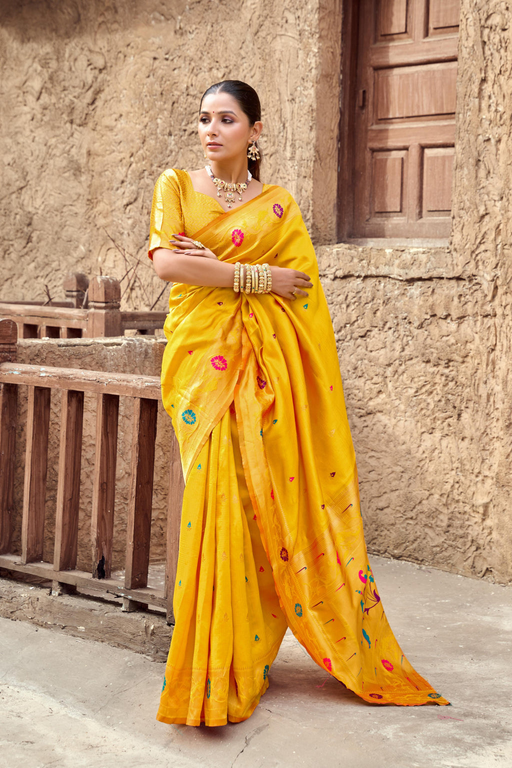 Traditional yellow paithani silk saree with zari weaving work