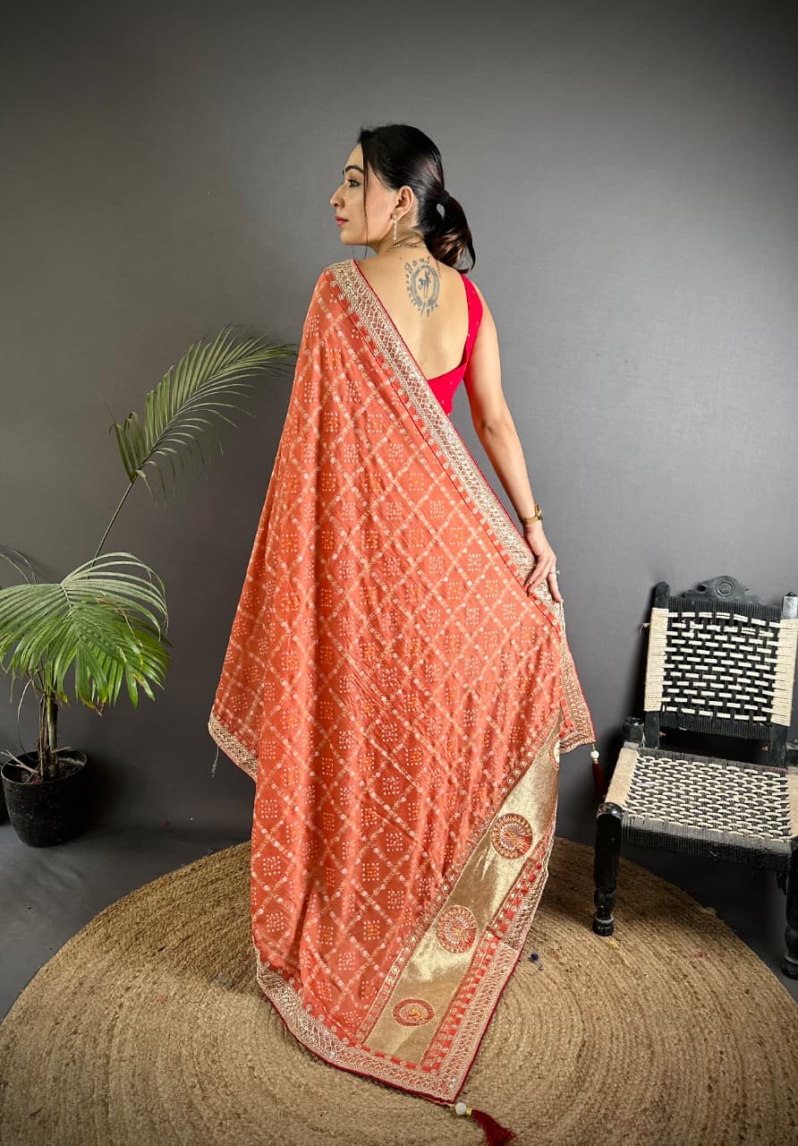 Orange traditional blooming vichitra khadi bandhej silk saree with sequence work