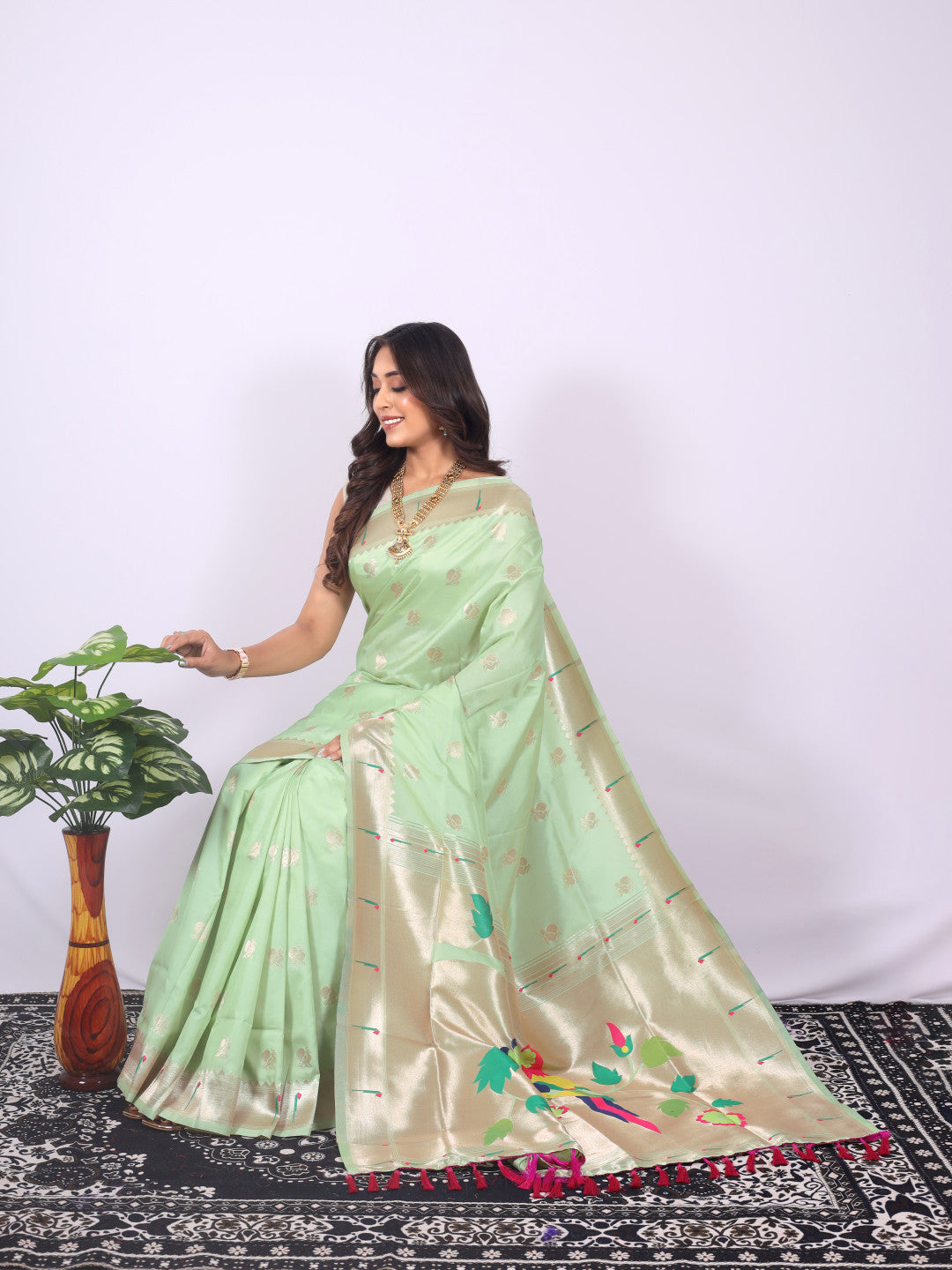 Pista green color paithani silk saree with zari weaving work