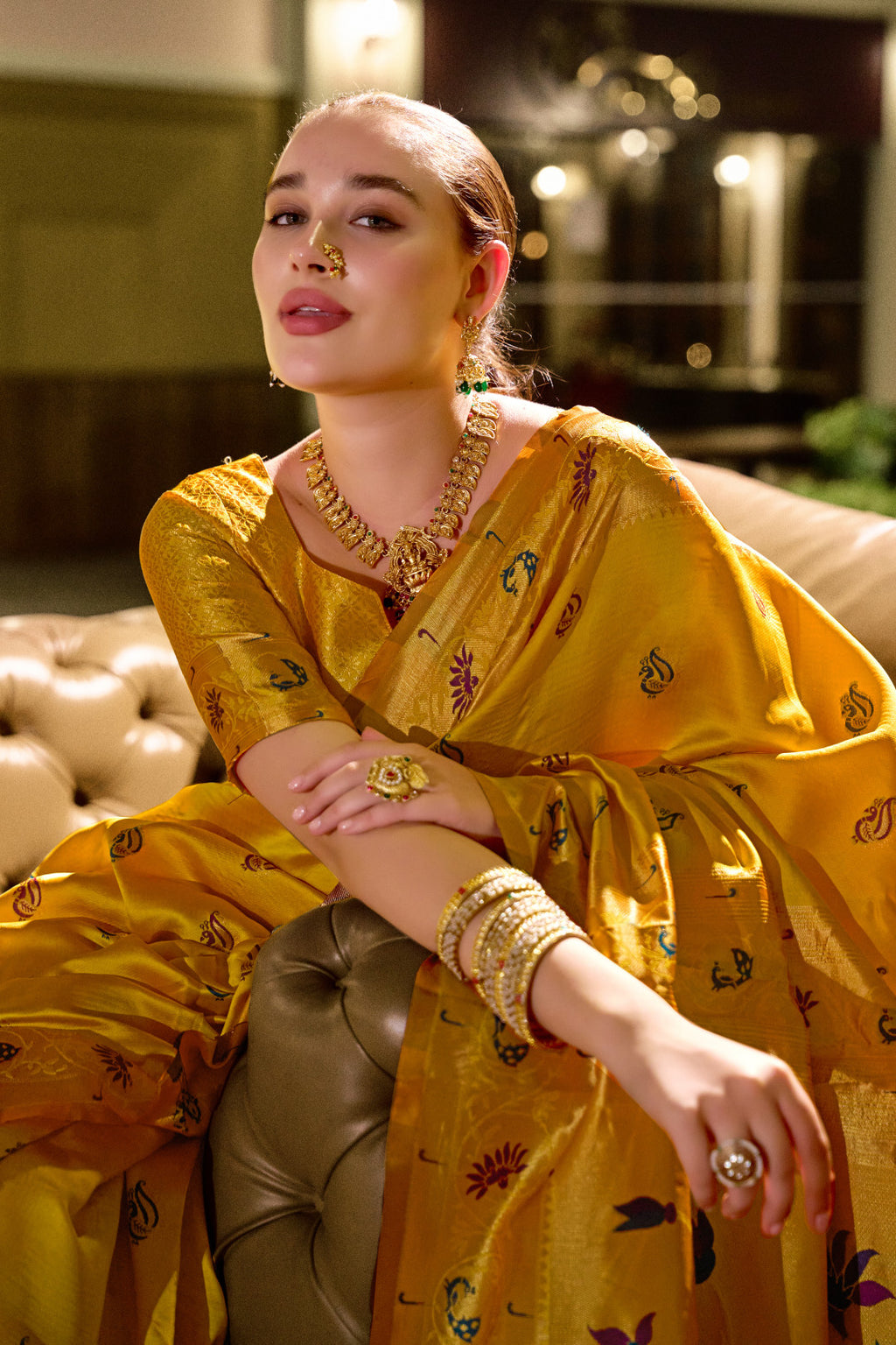 Traditional yellow paithani silk saree with zari weaving work