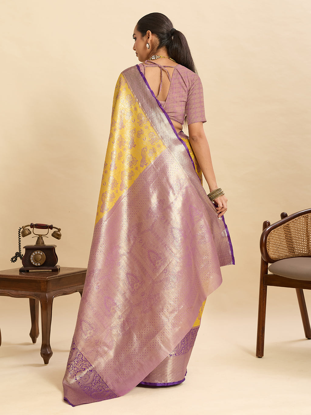 Yellow kanjivaram silk saree with zari weaving work and big border
