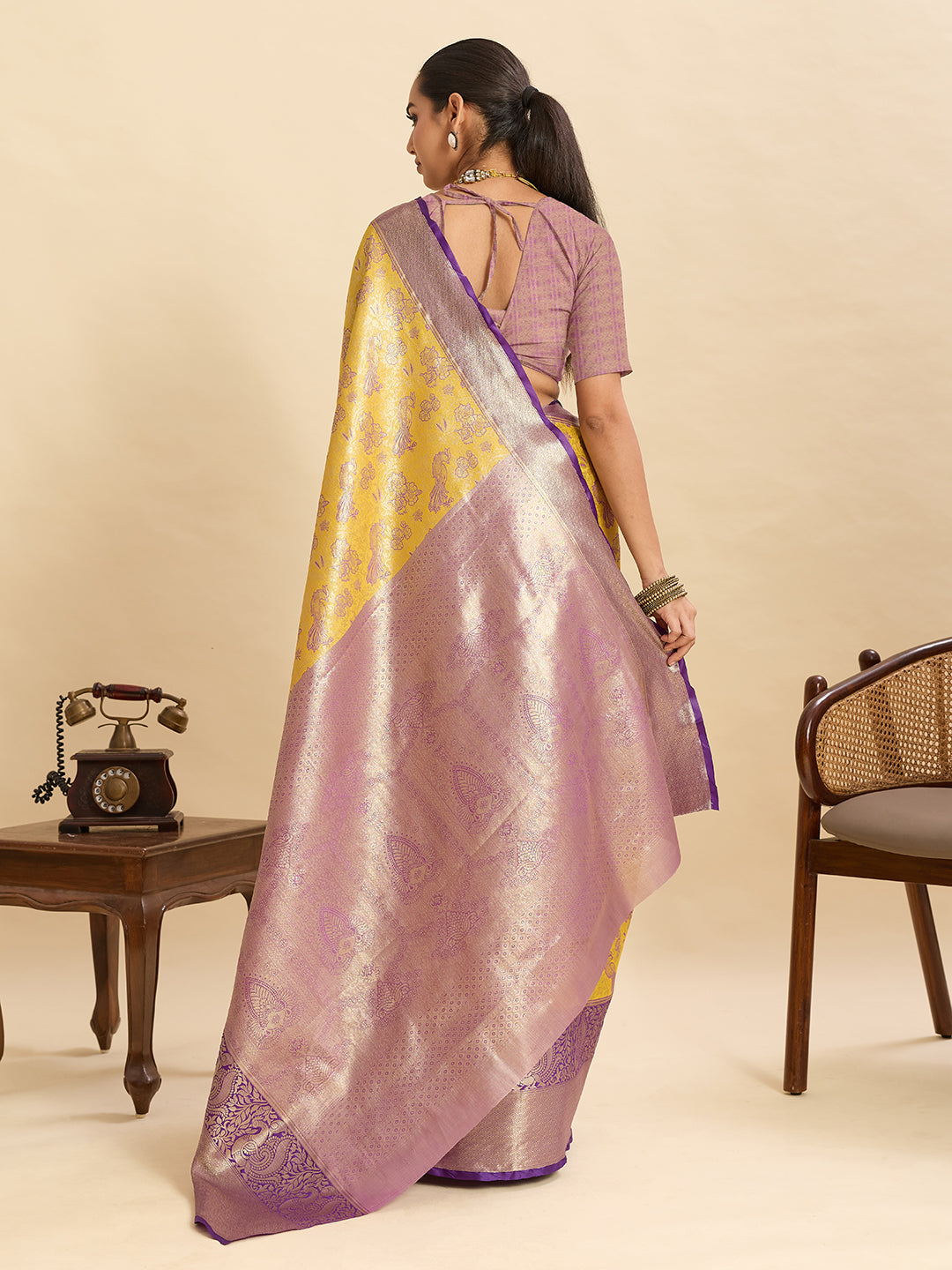 Yellow kanjivaram silk saree with zari weaving work and big border