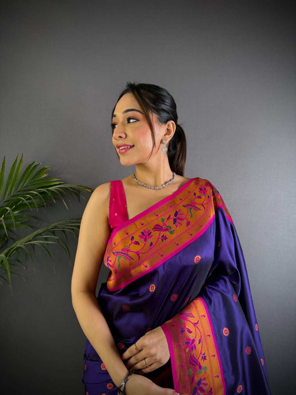 Purple colour paithani silk saree with zari weaving work