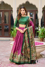 Magenta and green color dola silk lehenga with patola printed work