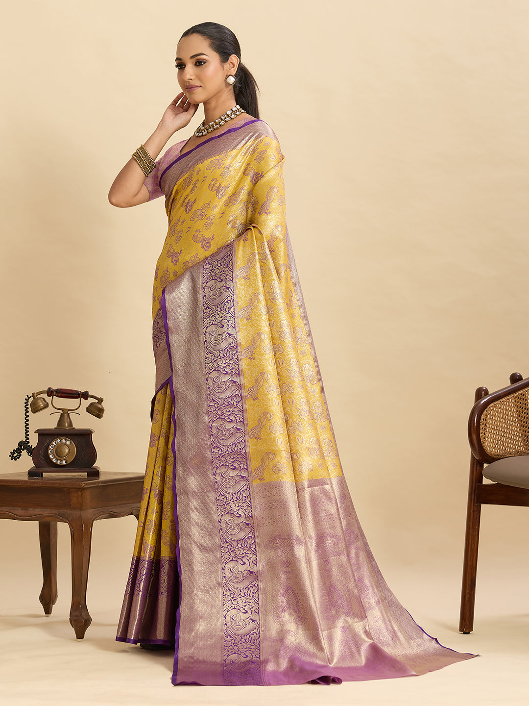 Yellow kanjivaram silk saree with zari weaving work and big border