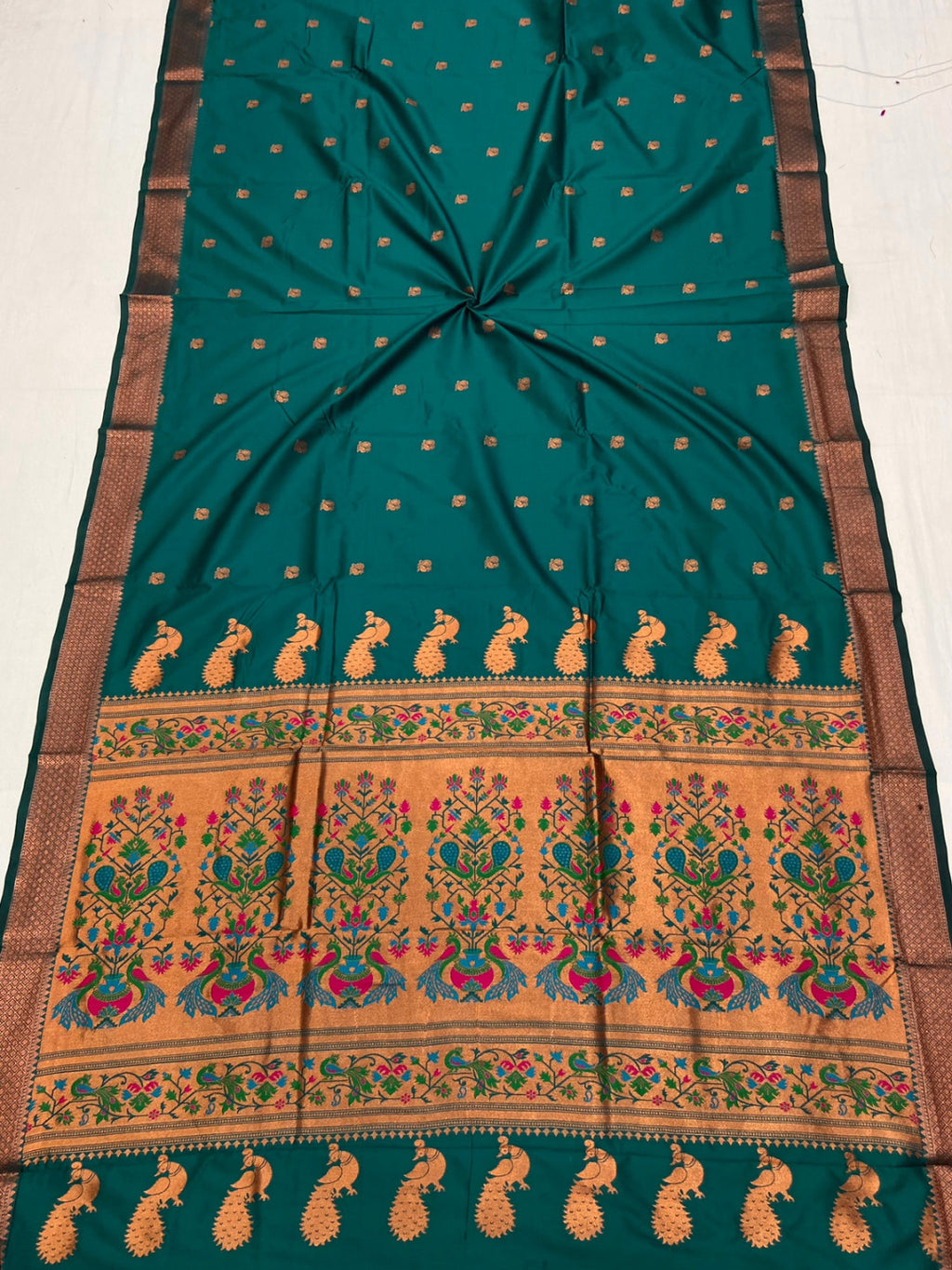 Rama green color paithani silk saree with zari weaving work