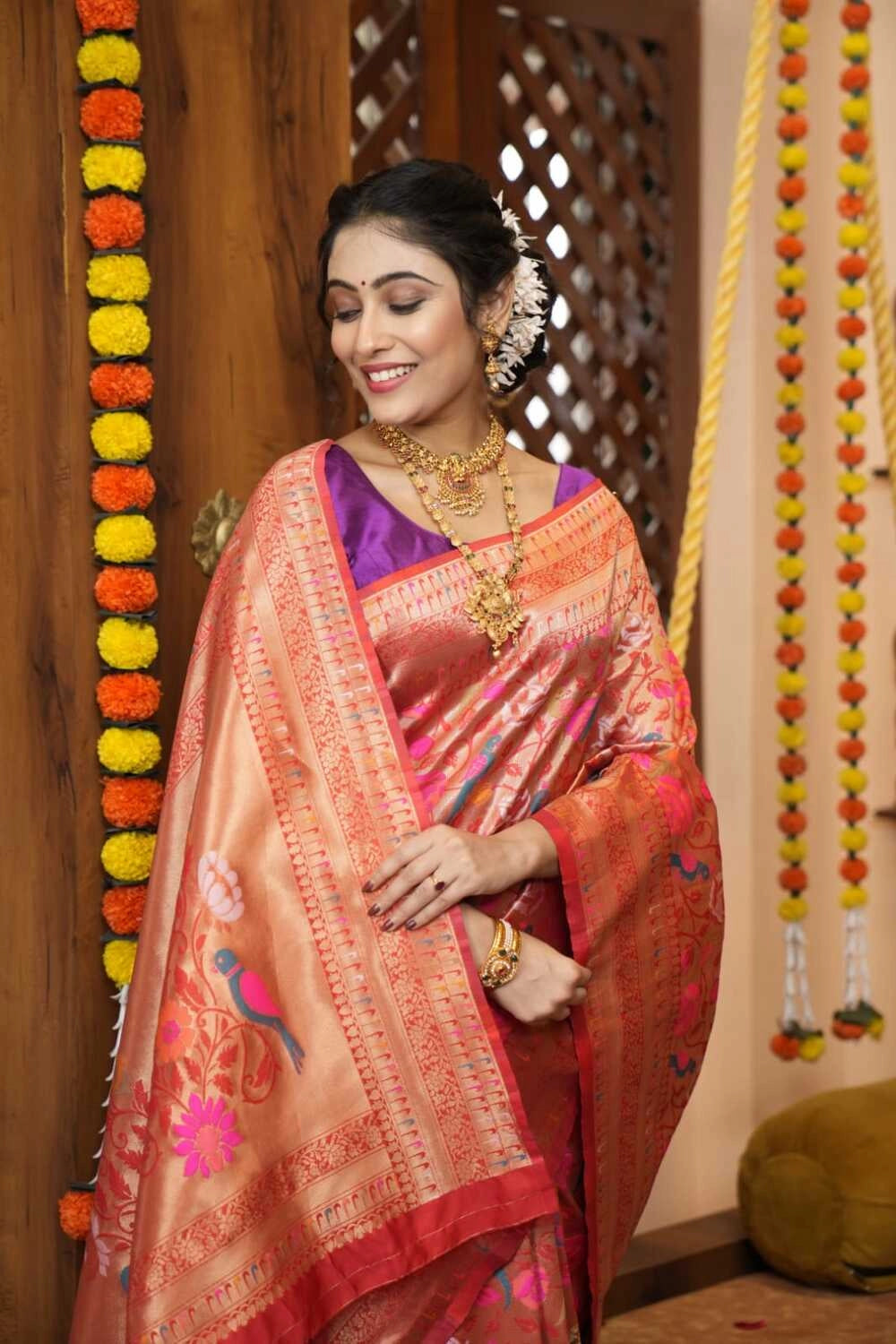 Red color paithani silk saree with zari weaving work
