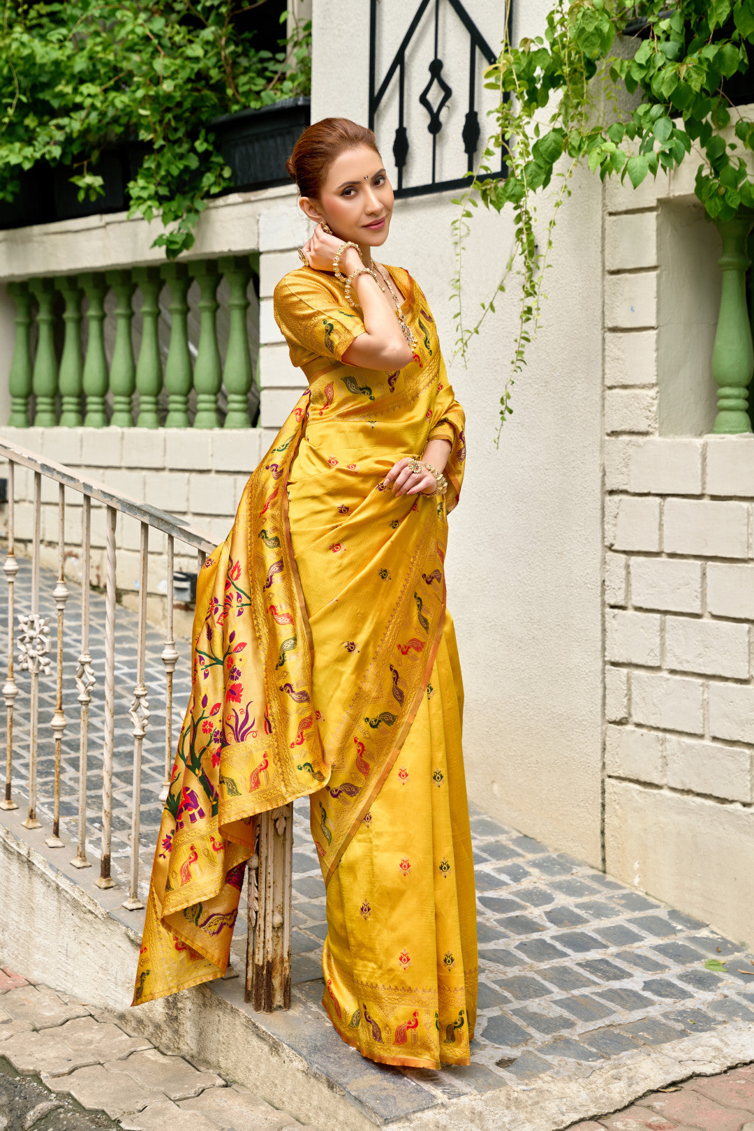 Traditional yellow paithani silk saree with zari weaving work