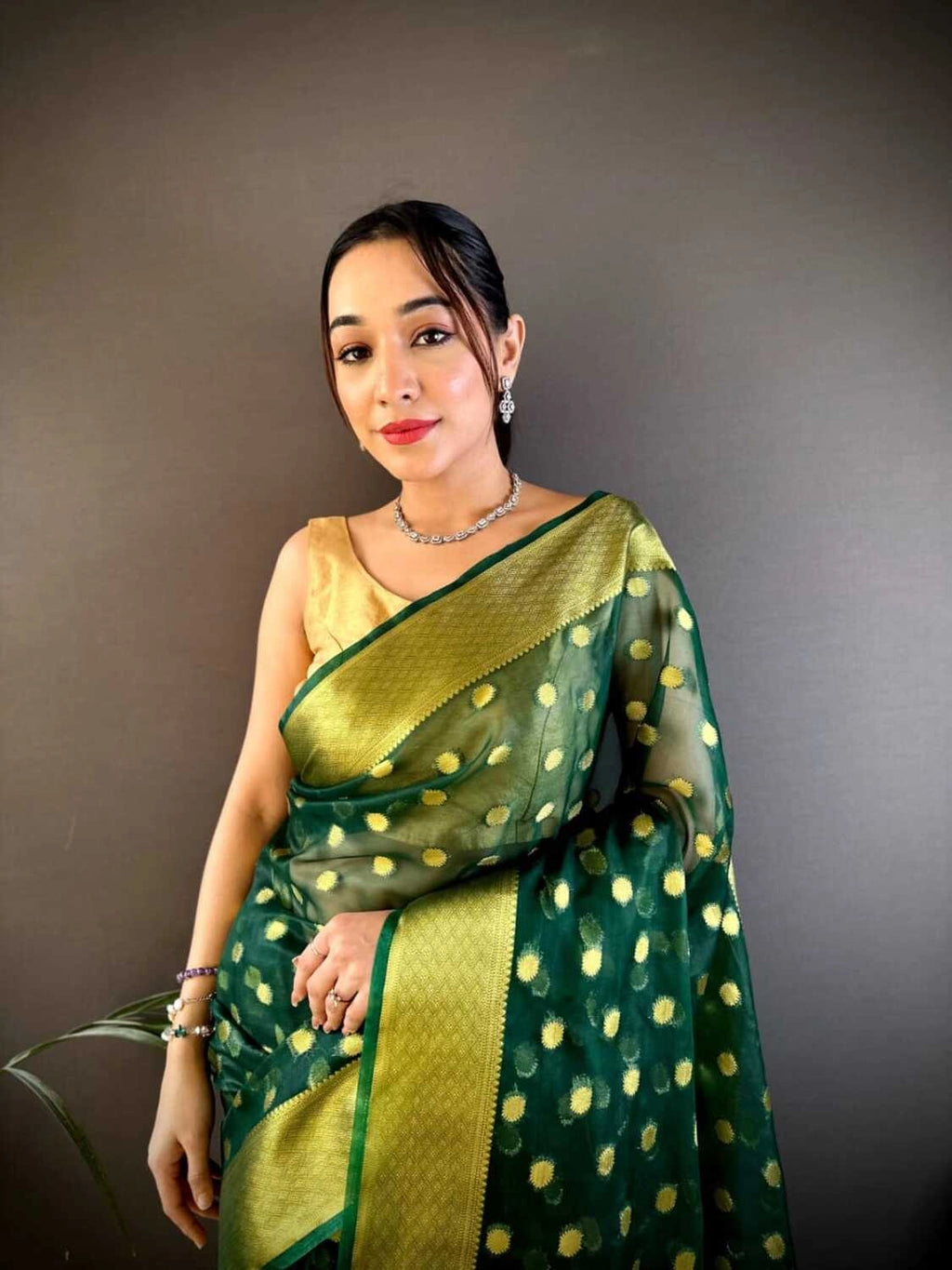 Green latest organza silk saree with zari weaving work