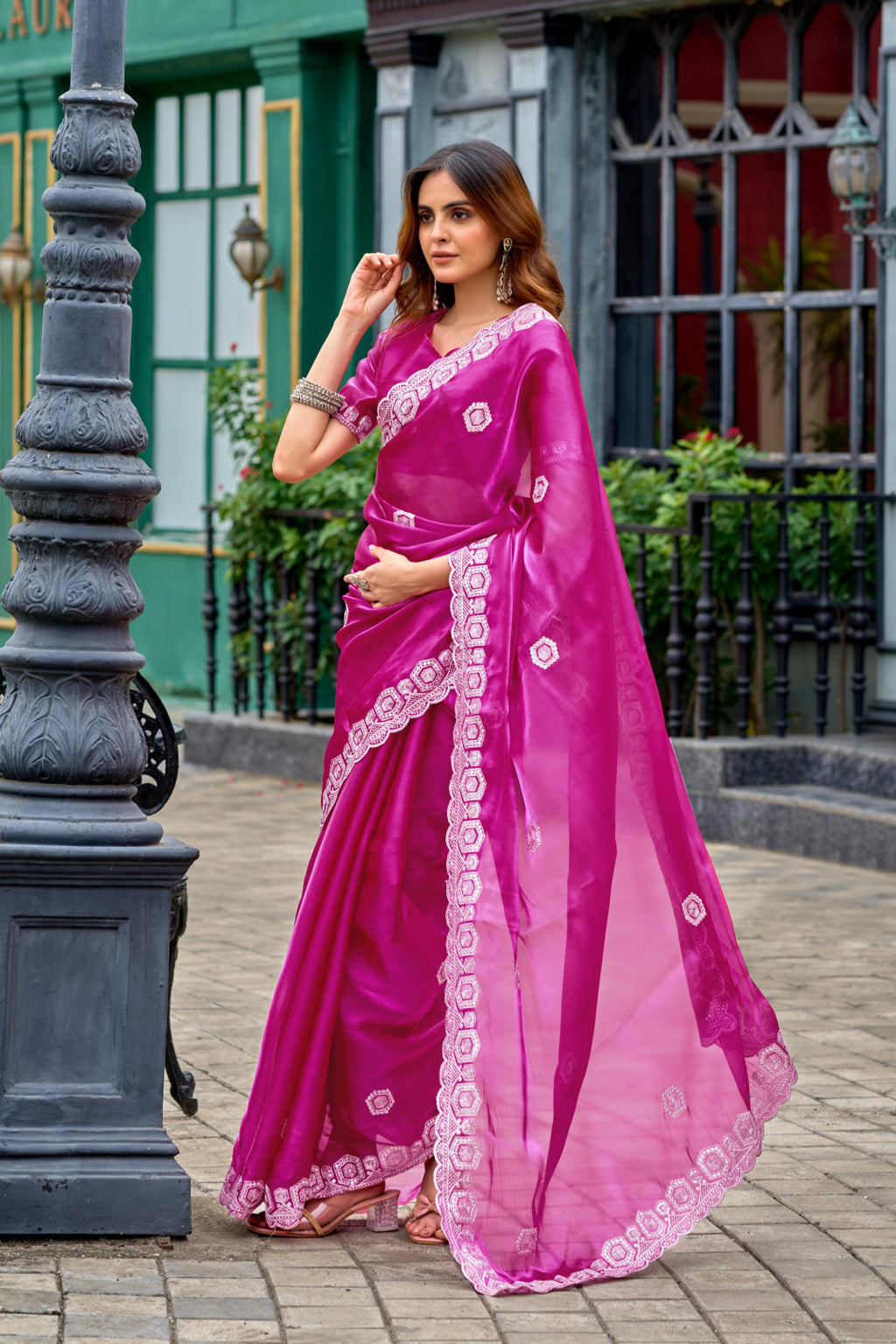 Rani pink fancy shimmer chiffon saree with embroidery work