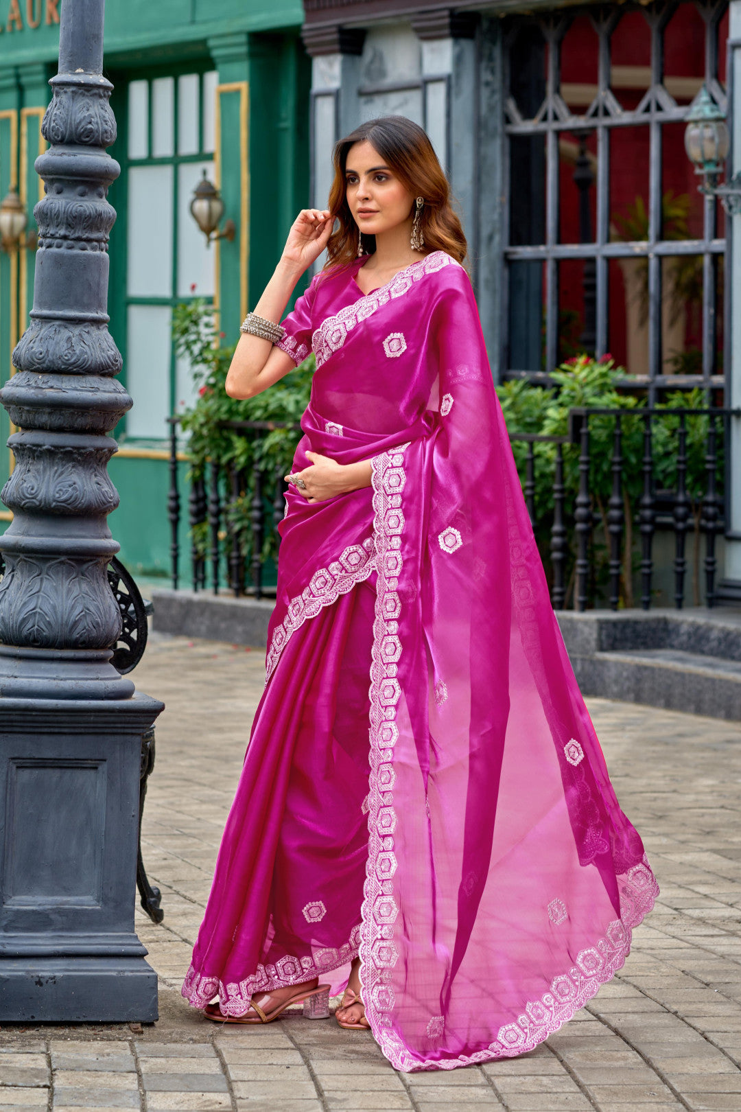 Rani pink fancy shimmer chiffon saree with embroidery work
