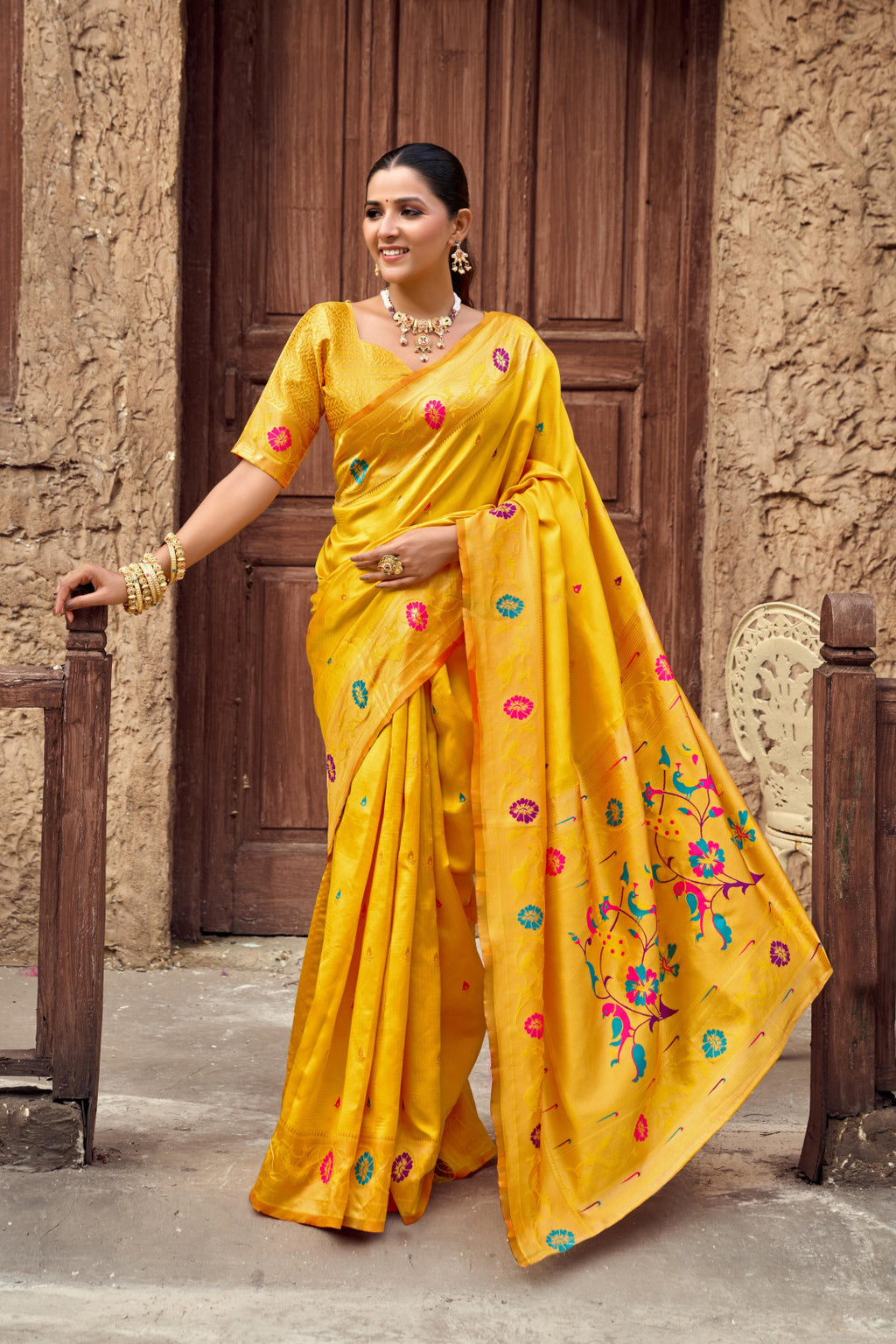 Traditional yellow paithani silk saree with zari weaving work
