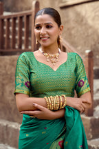 Traditional rama green paithani silk saree with zari weaving work