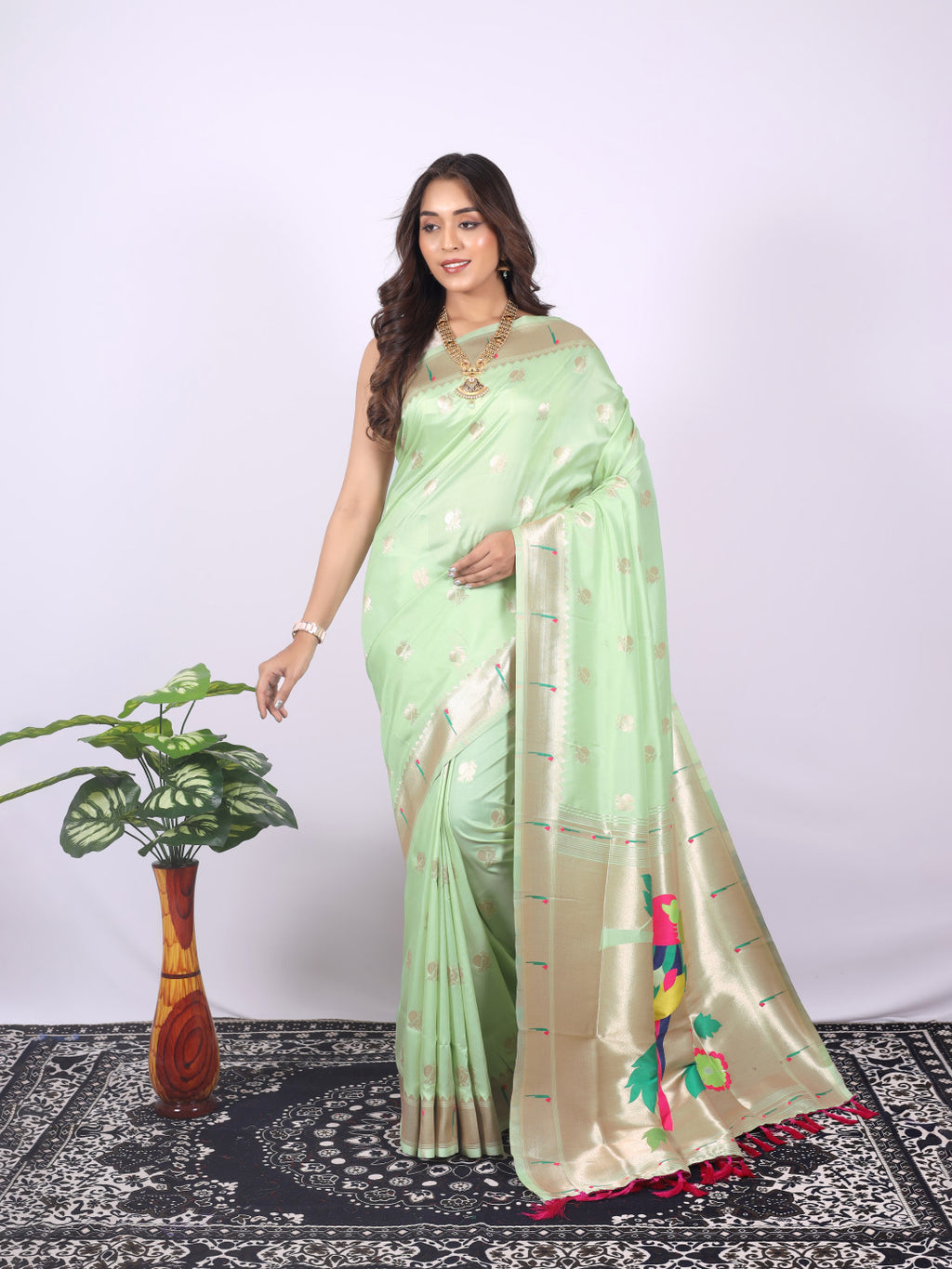Pista green color paithani silk saree with zari weaving work