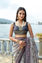 Gray color soft tussar silk saree with zari weaving work