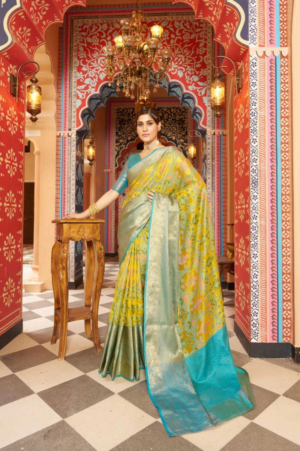 Yellow color soft organza silk saree with woven design