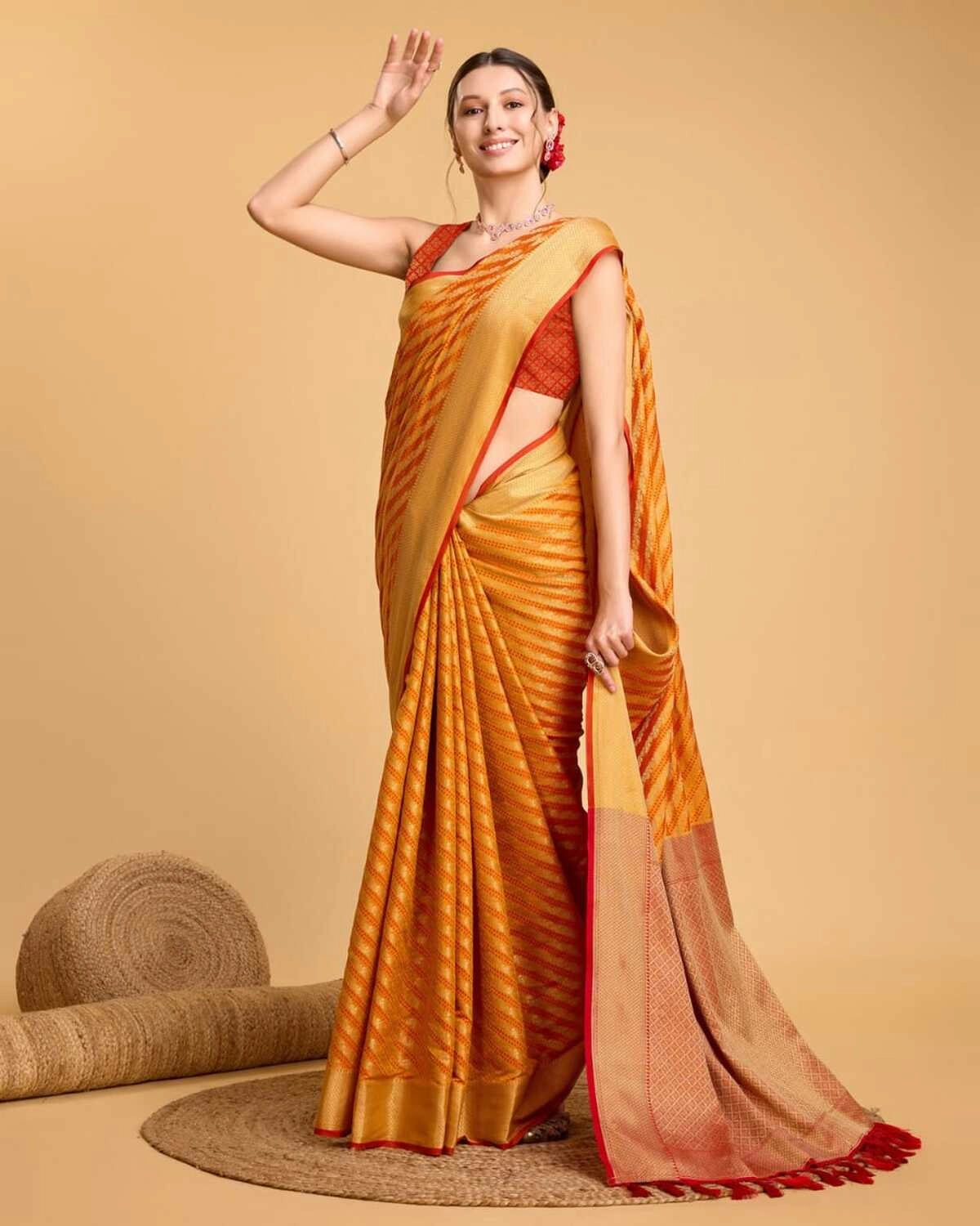 Orange color kanchipuram silk saree with zari woven work