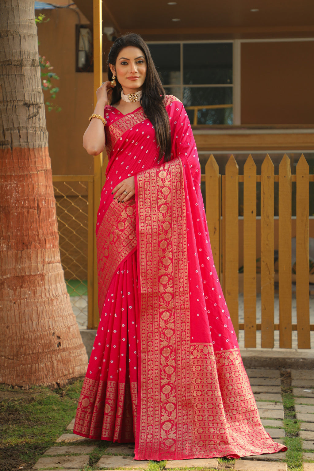 Pink color bandhej silk saree with zari weaving work