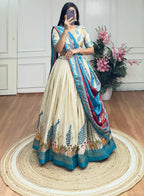 White and sky blue color dola silk lehenga with foil and patola printed work