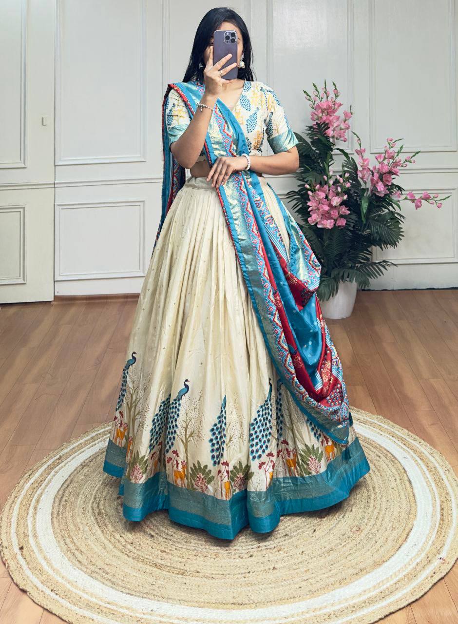 White and sky blue color dola silk lehenga with foil and patola printed work