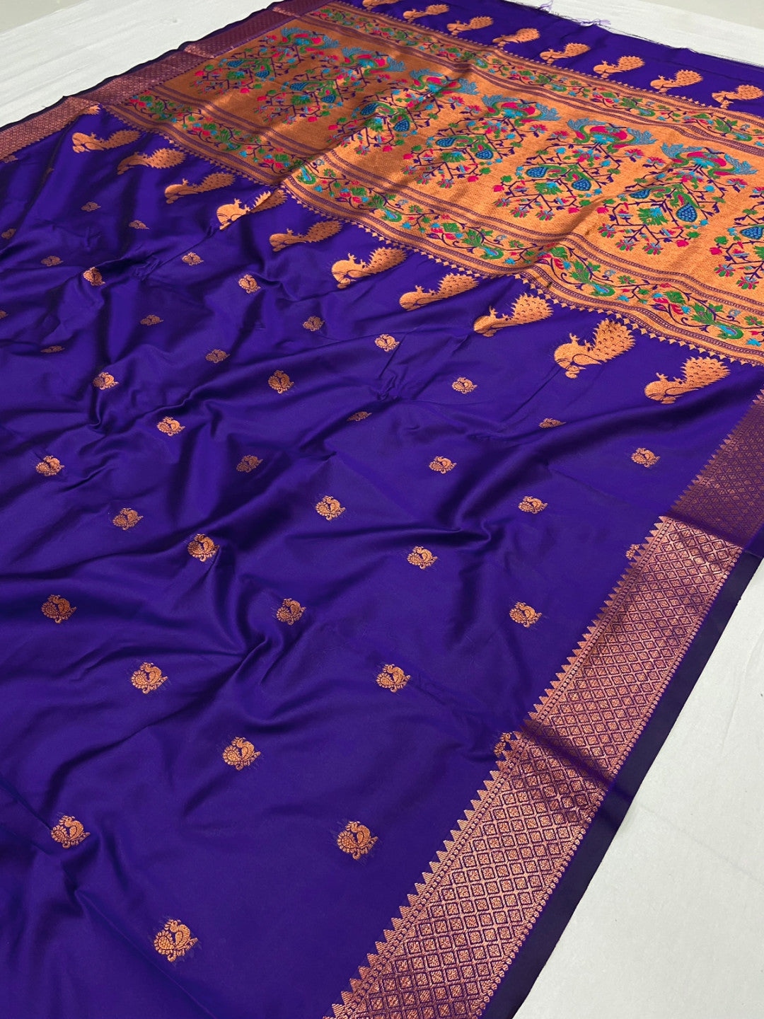 Violet color paithani silk saree with zari weaving work