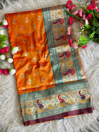 Orange traditional paithani silk saree with peacock zari weaving work