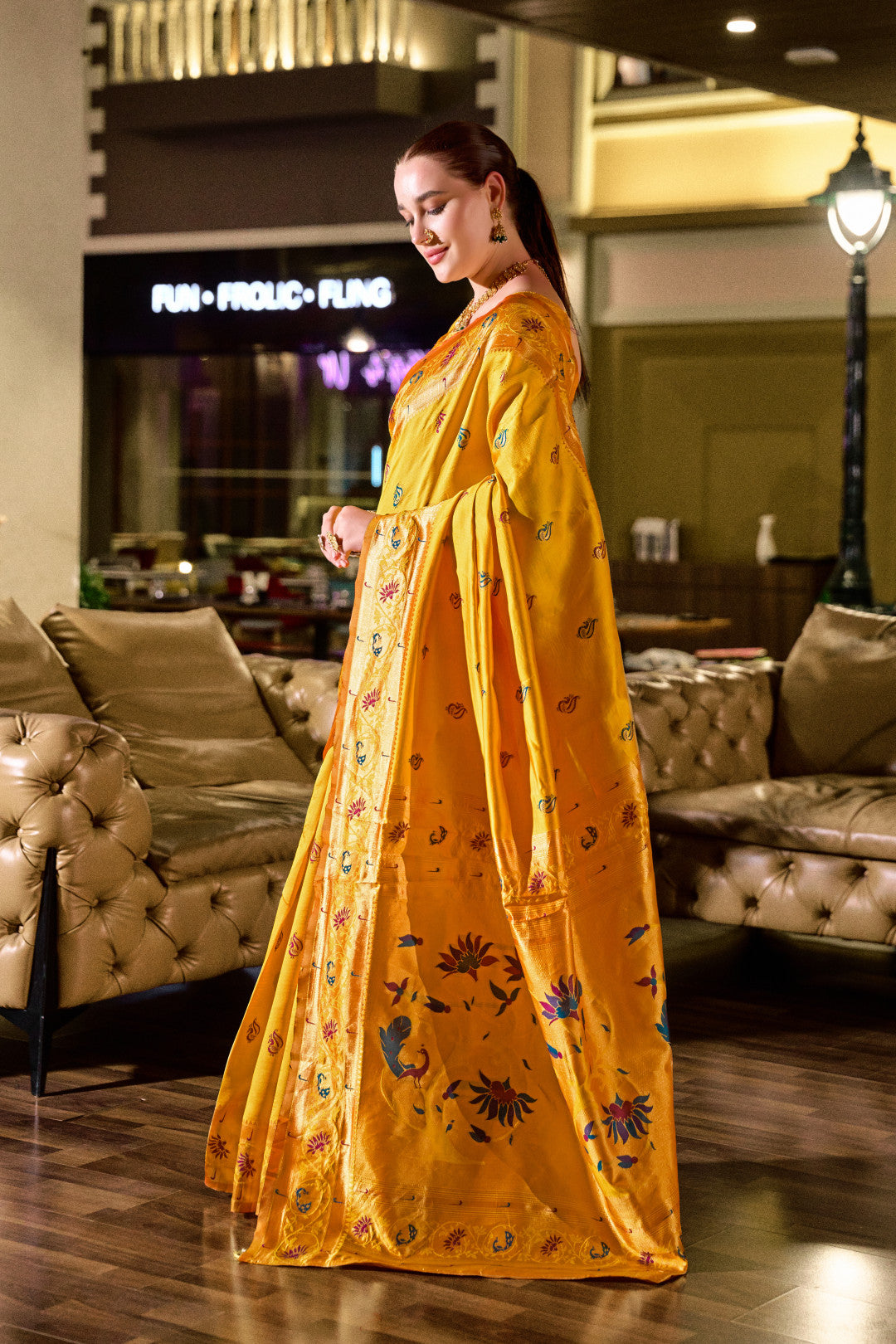 Traditional yellow paithani silk saree with zari weaving work