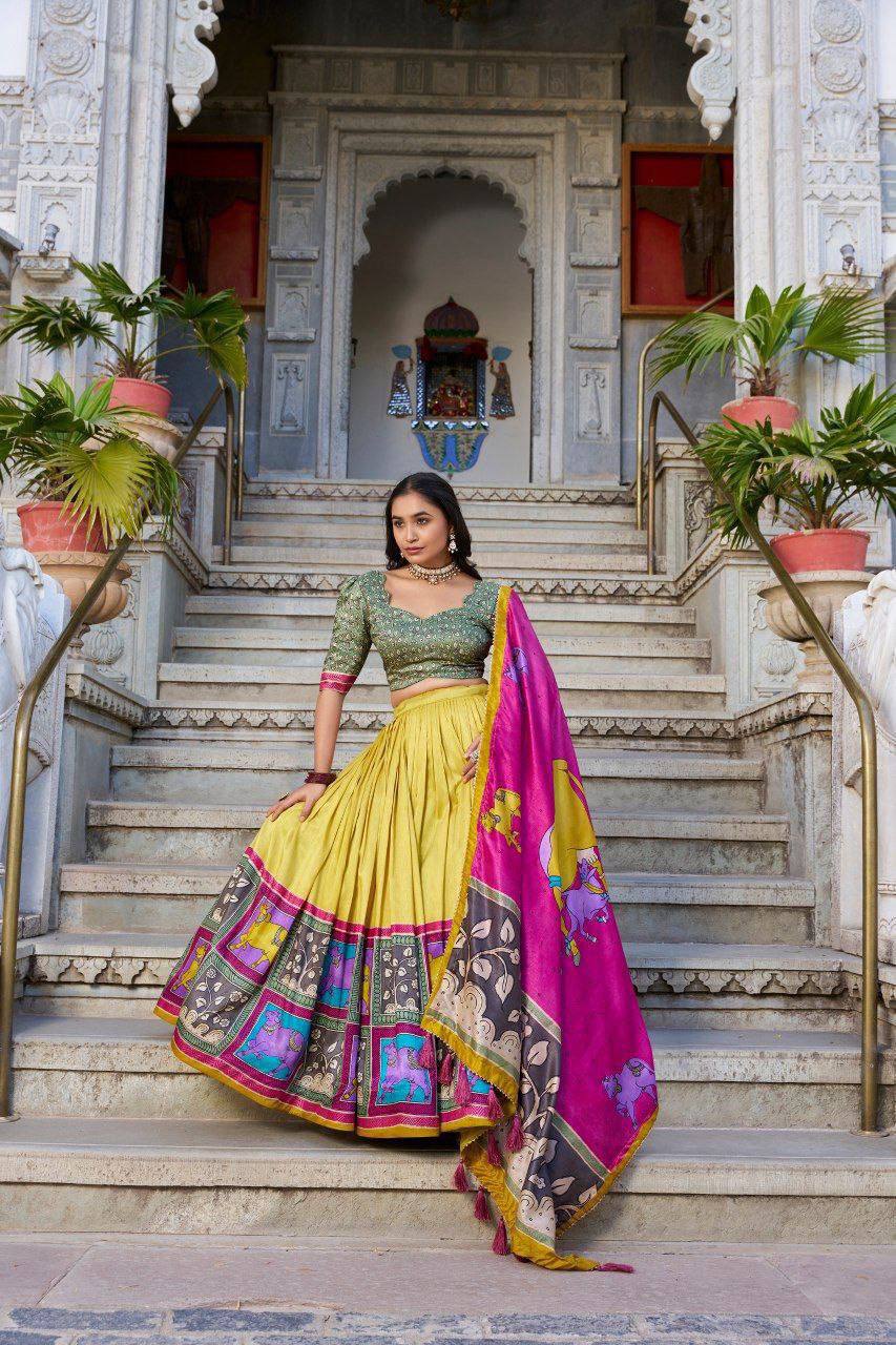 Yellow color tussar silk lehenga with meenakari printed work