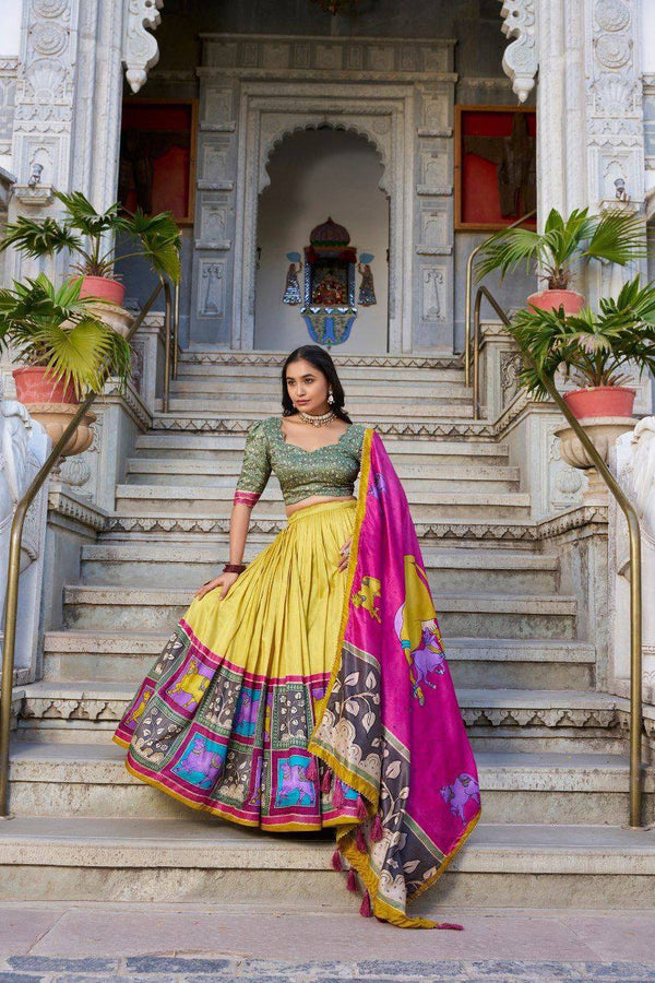 Yellow color tussar silk lehenga with meenakari printed work