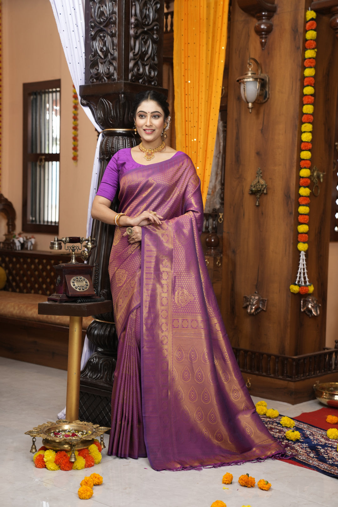 Purple color kanjivaram silk saree with zari weaving work