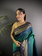 Rama green color banarasi silk saree with zari weaving work