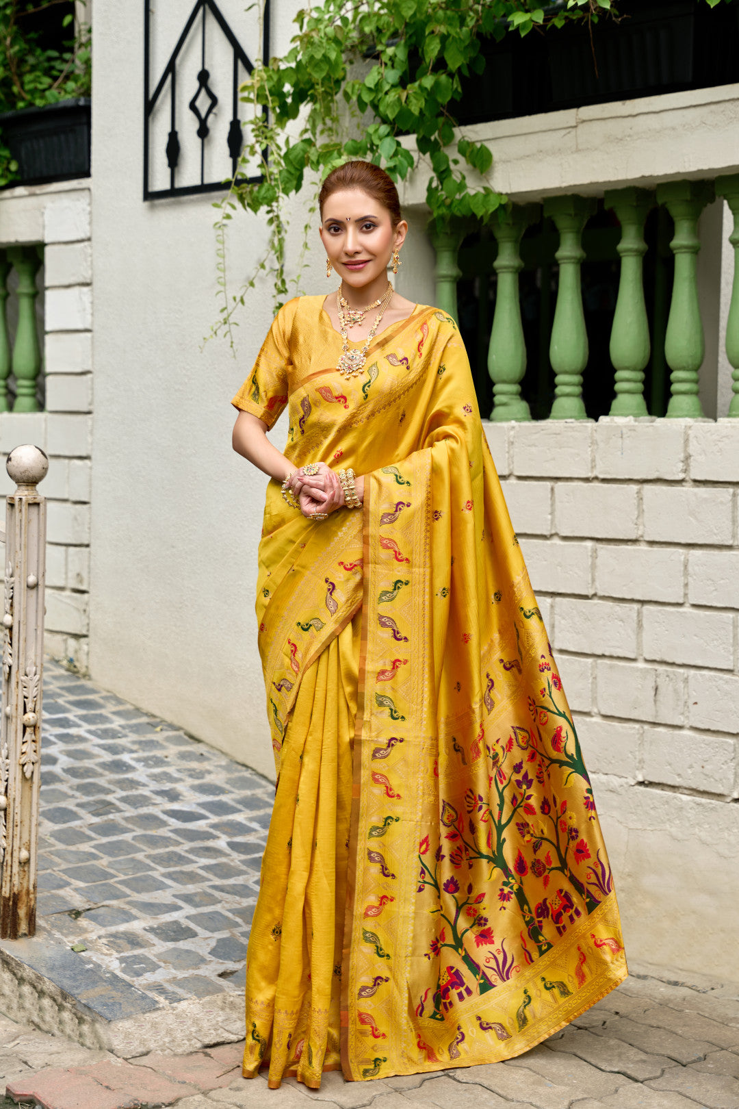 Traditional yellow paithani silk saree with zari weaving work