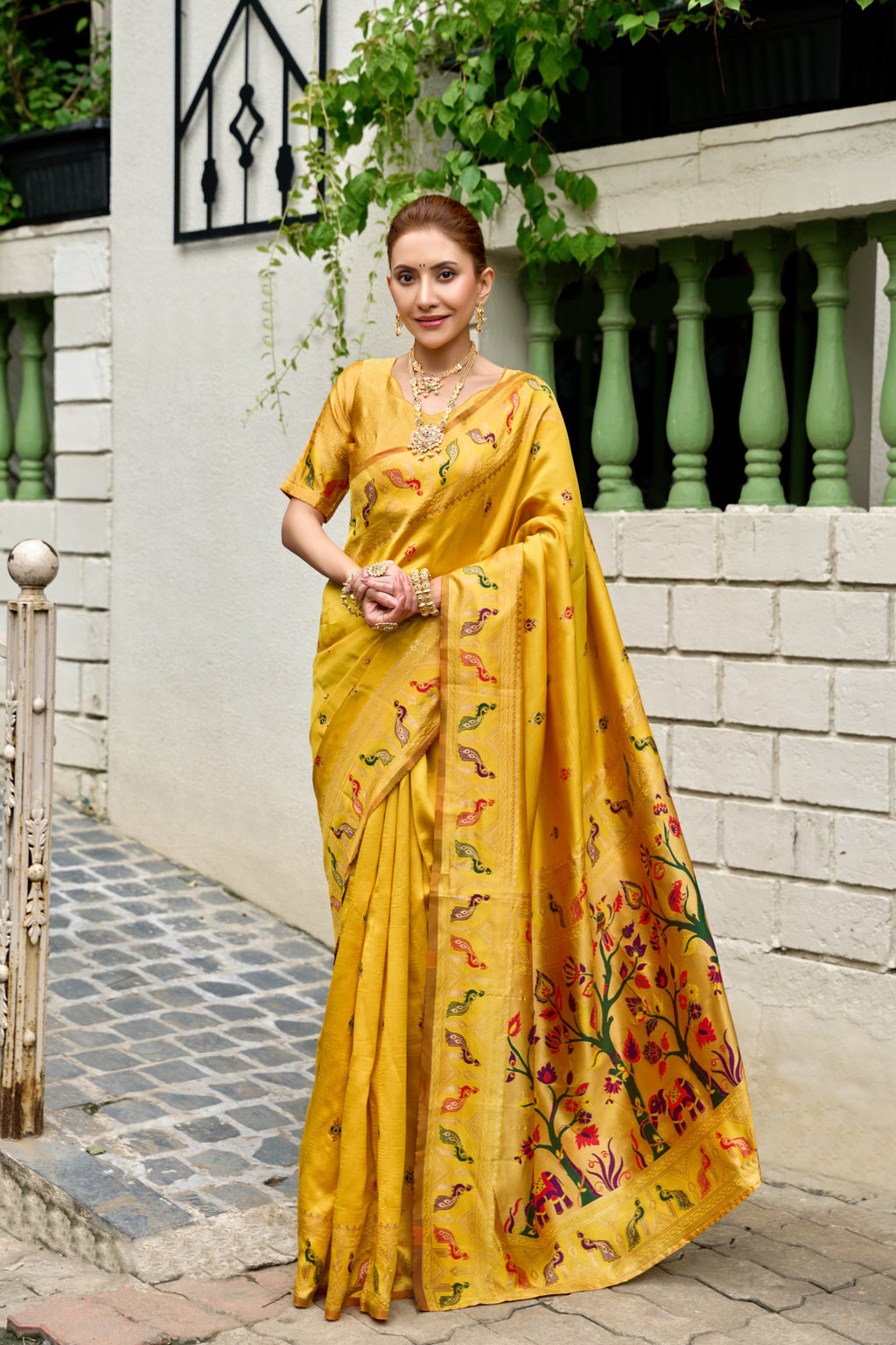 Traditional yellow paithani silk saree with zari weaving work