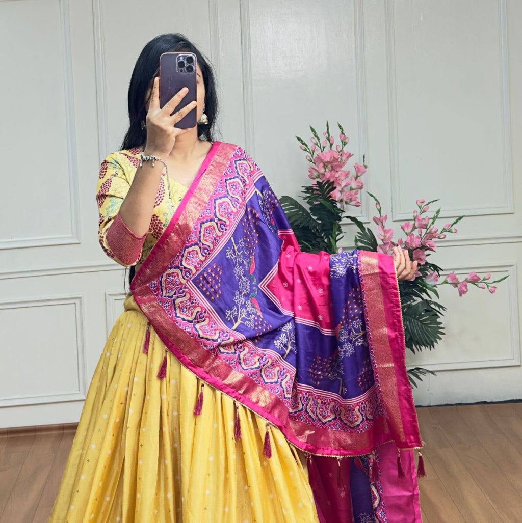 Yellow and pink color dola silk lehenga with foil and patola printed work