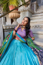 Blue color tussar silk lehenga with meenakari printed work