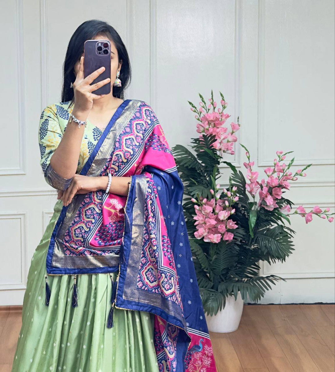 Pista green and blue color dola silk lehenga with foil and patola printed work