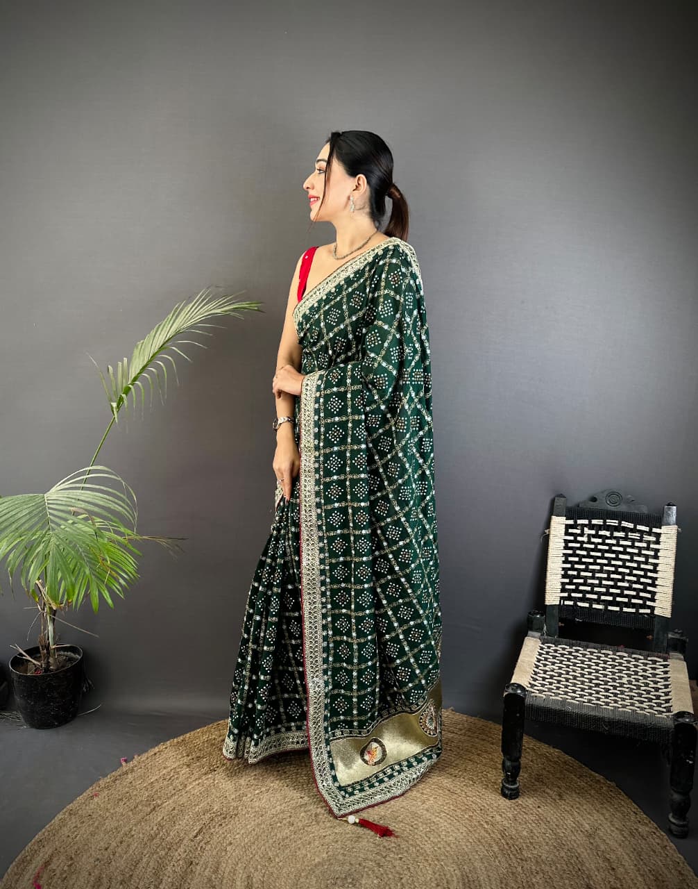 Dark green traditional blooming vichitra khadi bandhej silk saree with sequence work