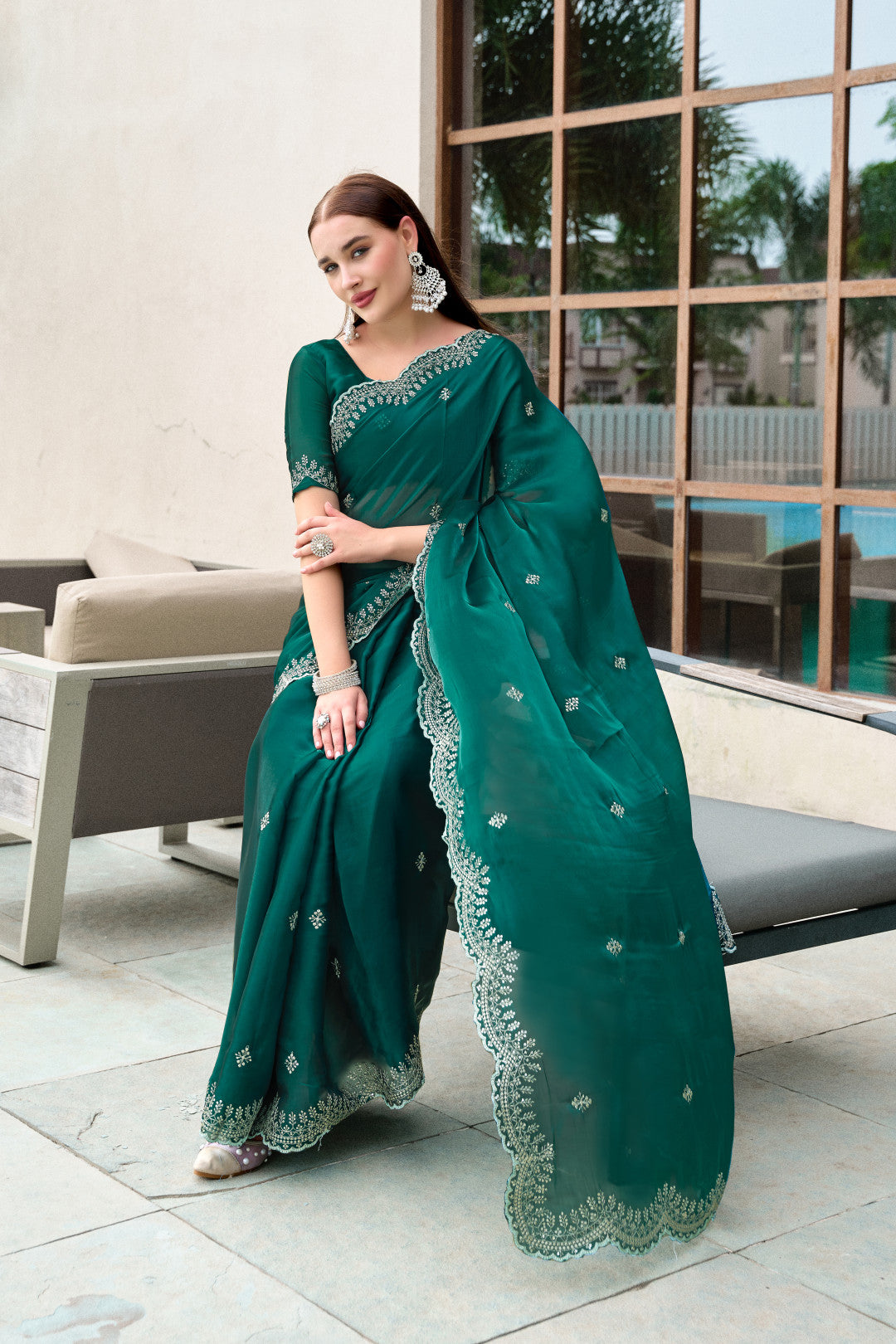 Dark green fancy shimmer chiffon saree with embroidery work