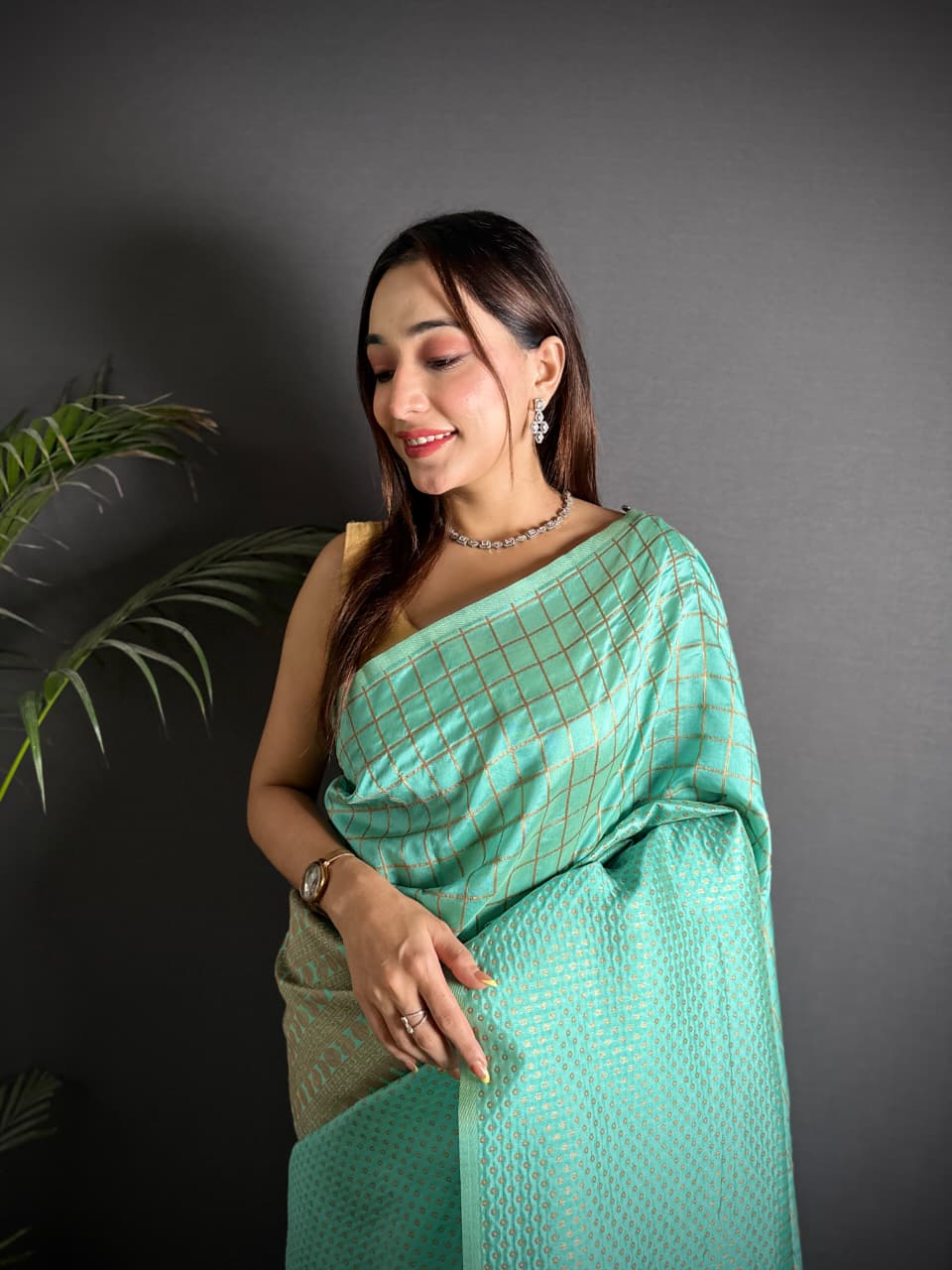 Sea green color banarasi silk saree with zari weaving work