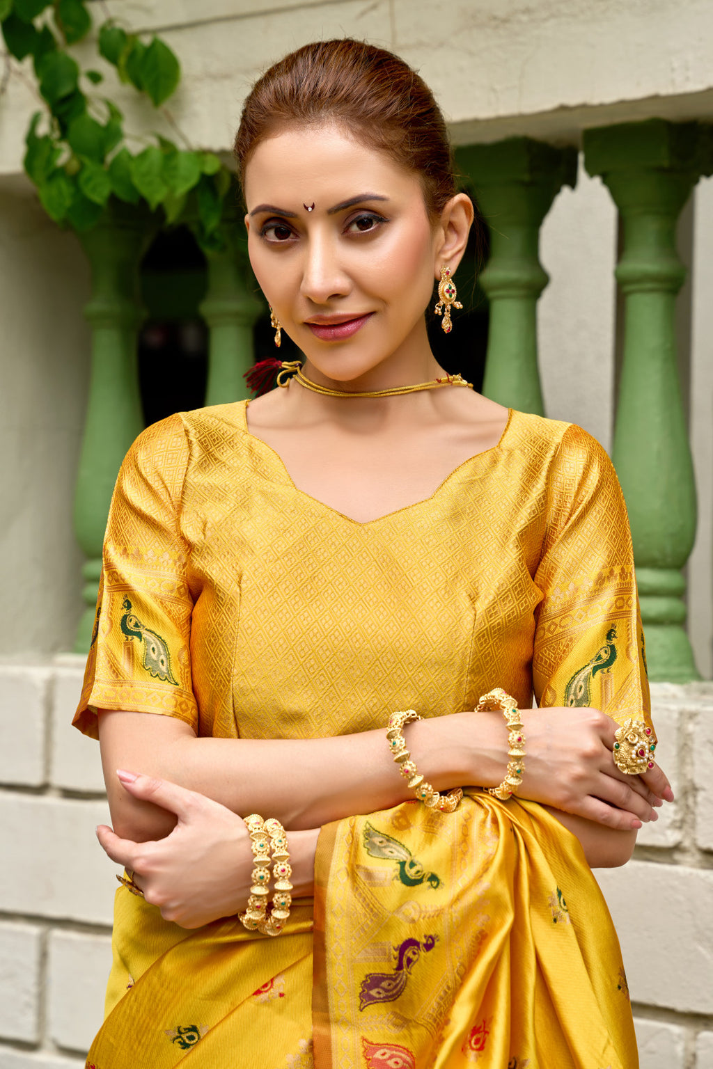 Traditional yellow paithani silk saree with zari weaving work