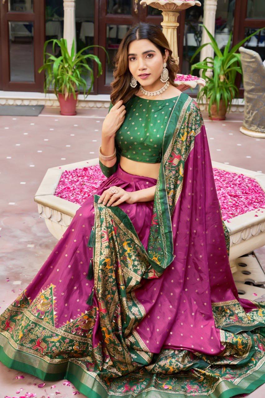 Magenta and green color dola silk lehenga with patola printed work