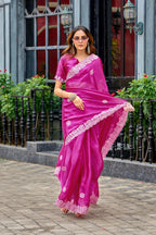 Rani pink fancy shimmer chiffon saree with embroidery work