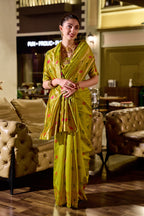 Traditional parrot green paithani silk saree with zari weaving work