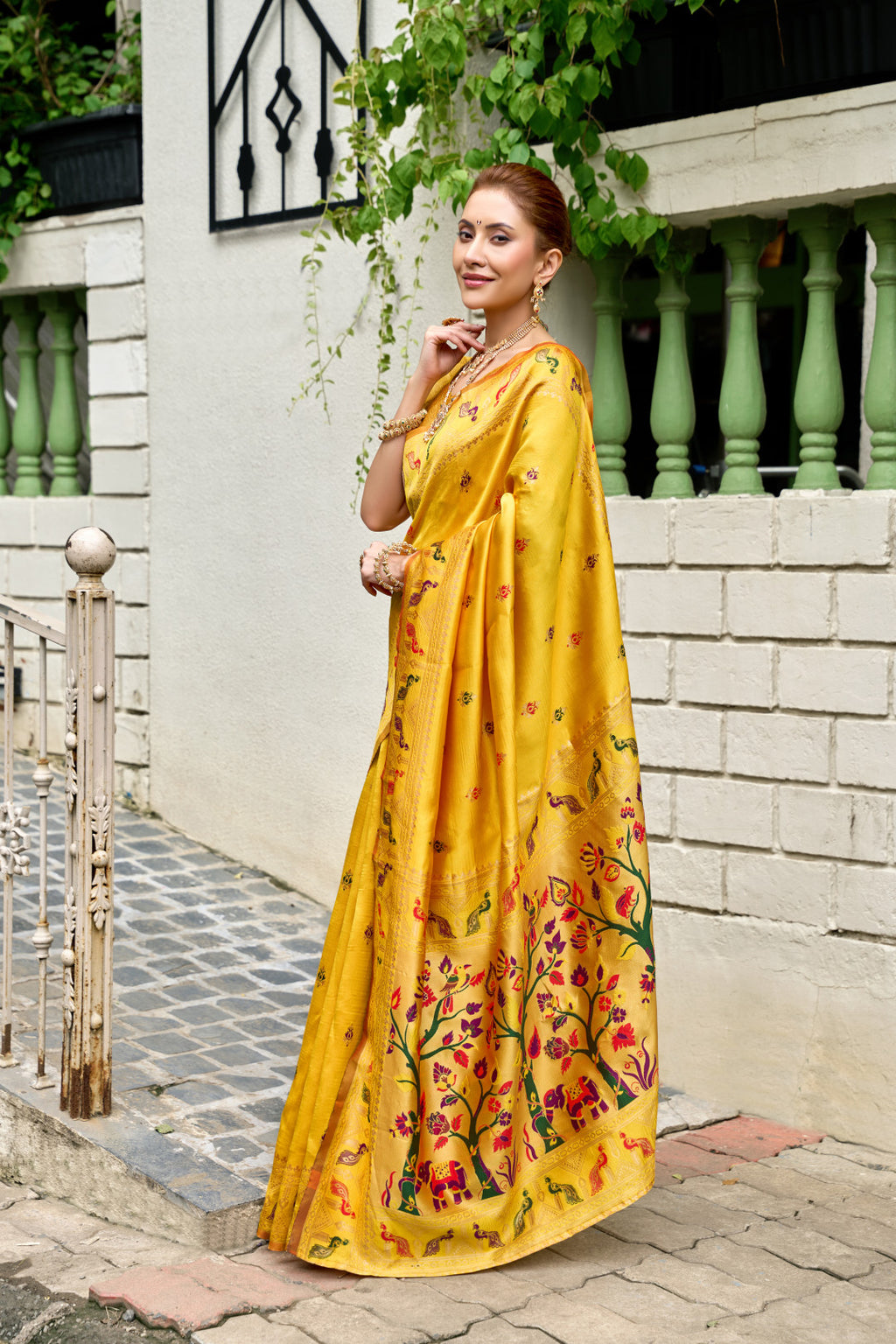 Traditional yellow paithani silk saree with zari weaving work