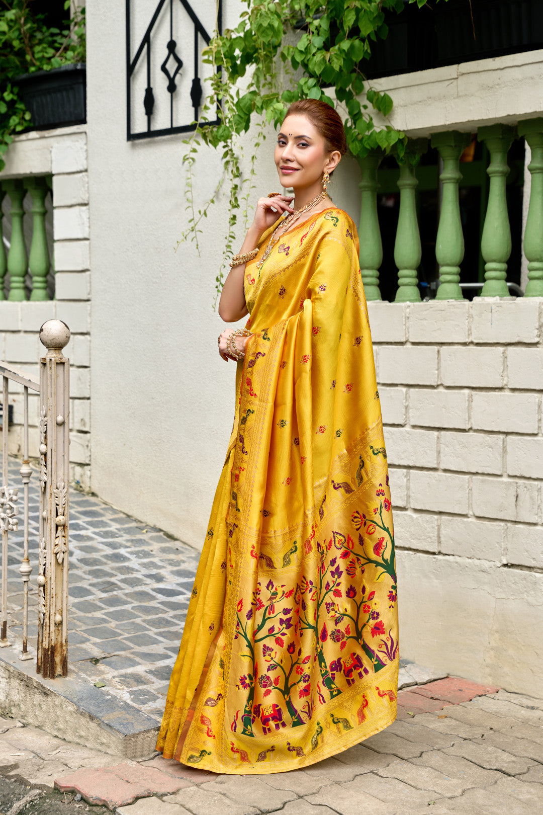 Traditional yellow paithani silk saree with zari weaving work