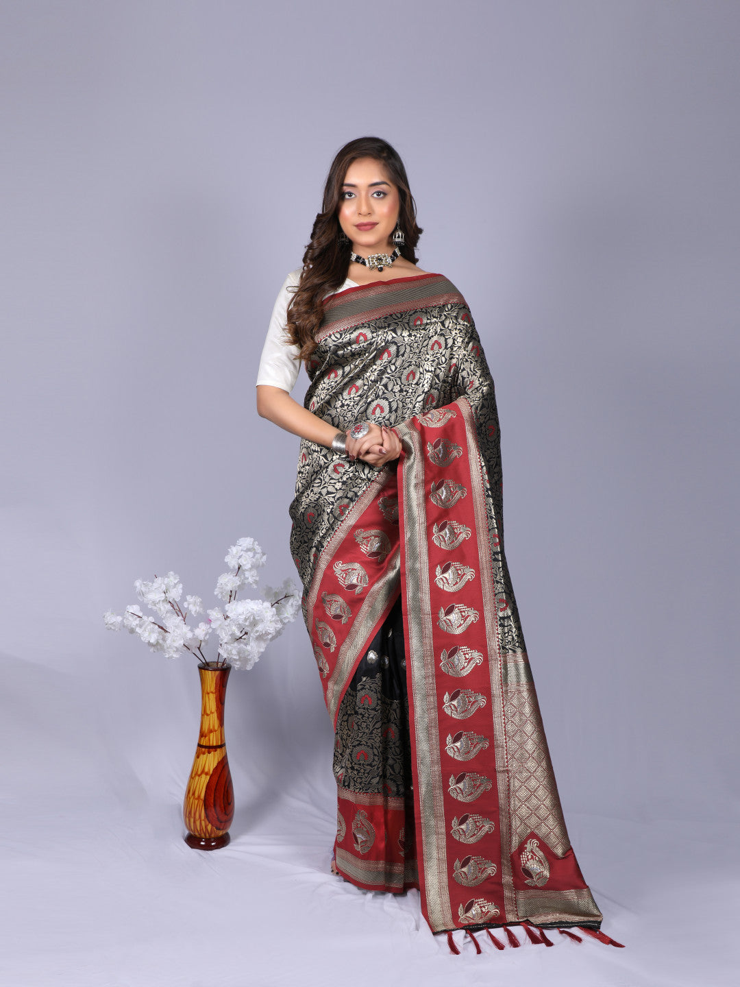 Black color kanchipuram silk saree with zari weaving work