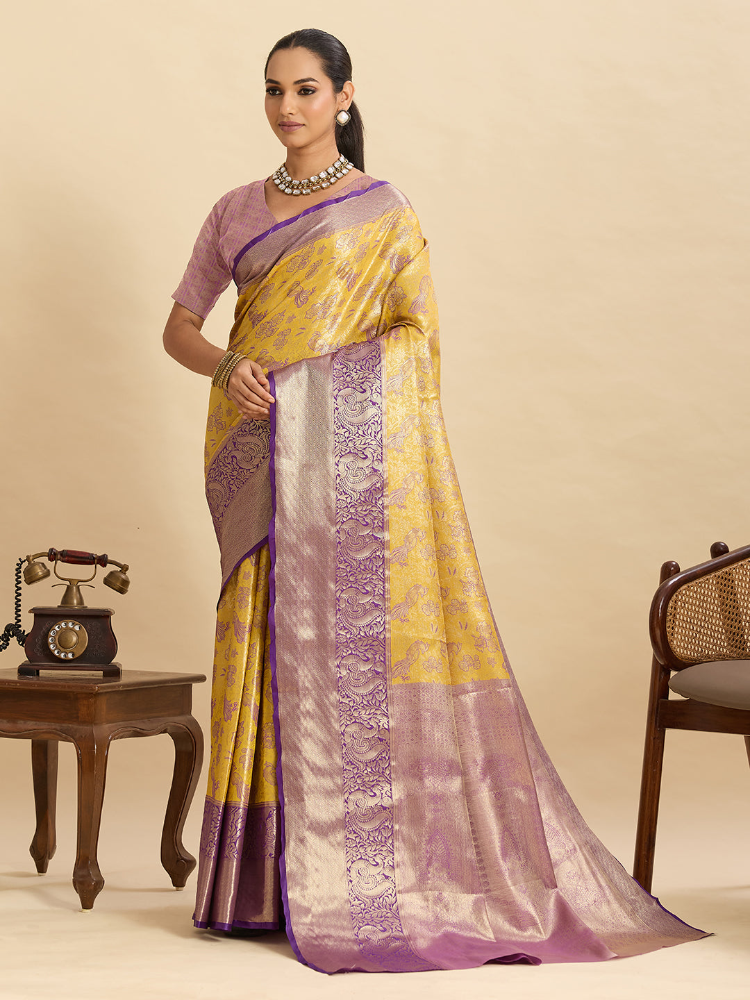 Yellow kanjivaram silk saree with zari weaving work and big border