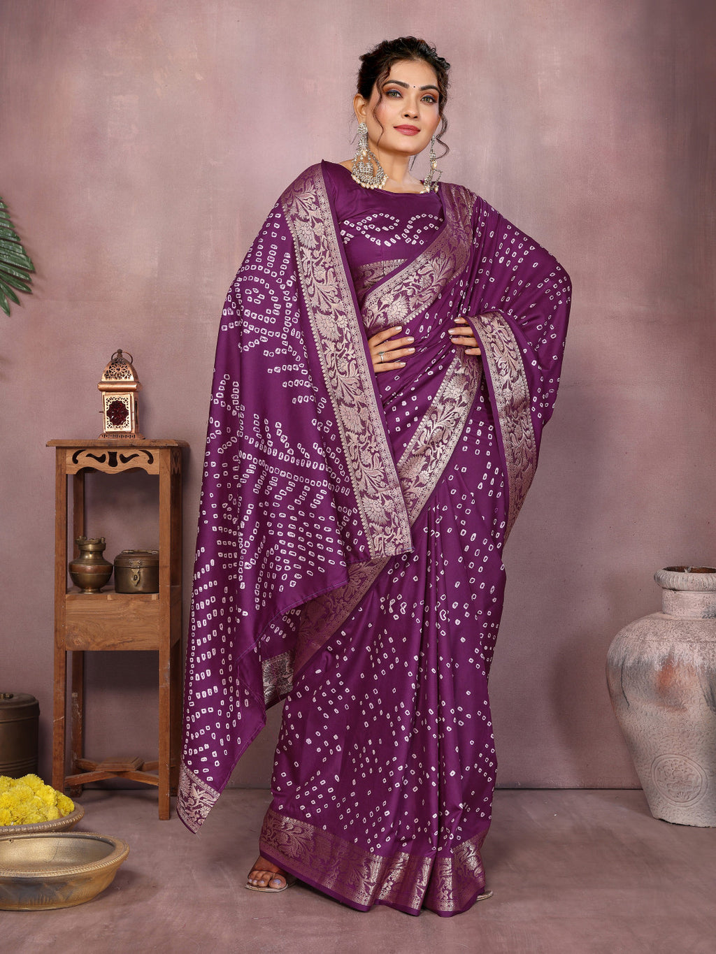 Magenta colour hand bandhej bandhani saree with zari weaving work