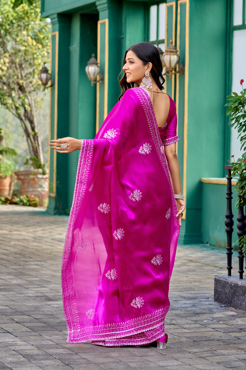 Rani pink fancy shimmer chiffon saree with embroidery work